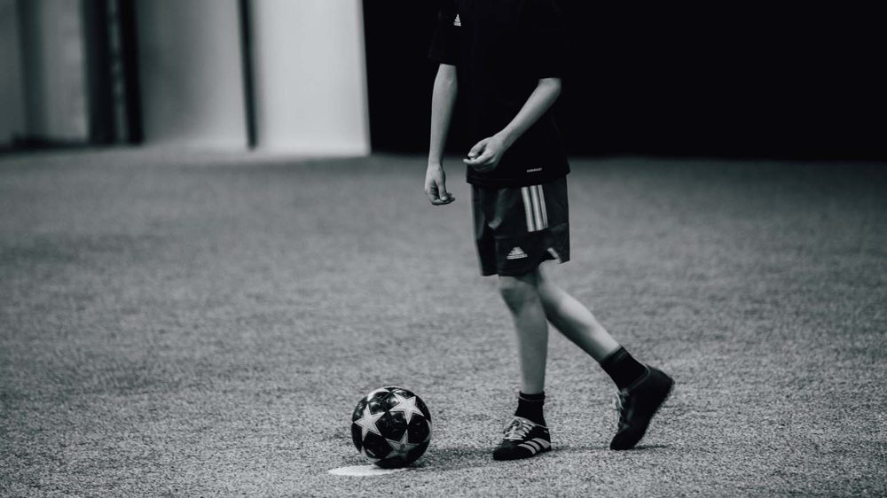 Soccer player controlling the ball during an indoor training session at Prestige Indoor Sports