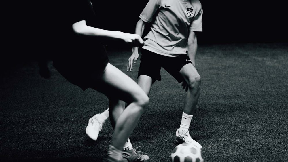 Soccer player leaping during an explosive training drill at Prestige Indoor Sports